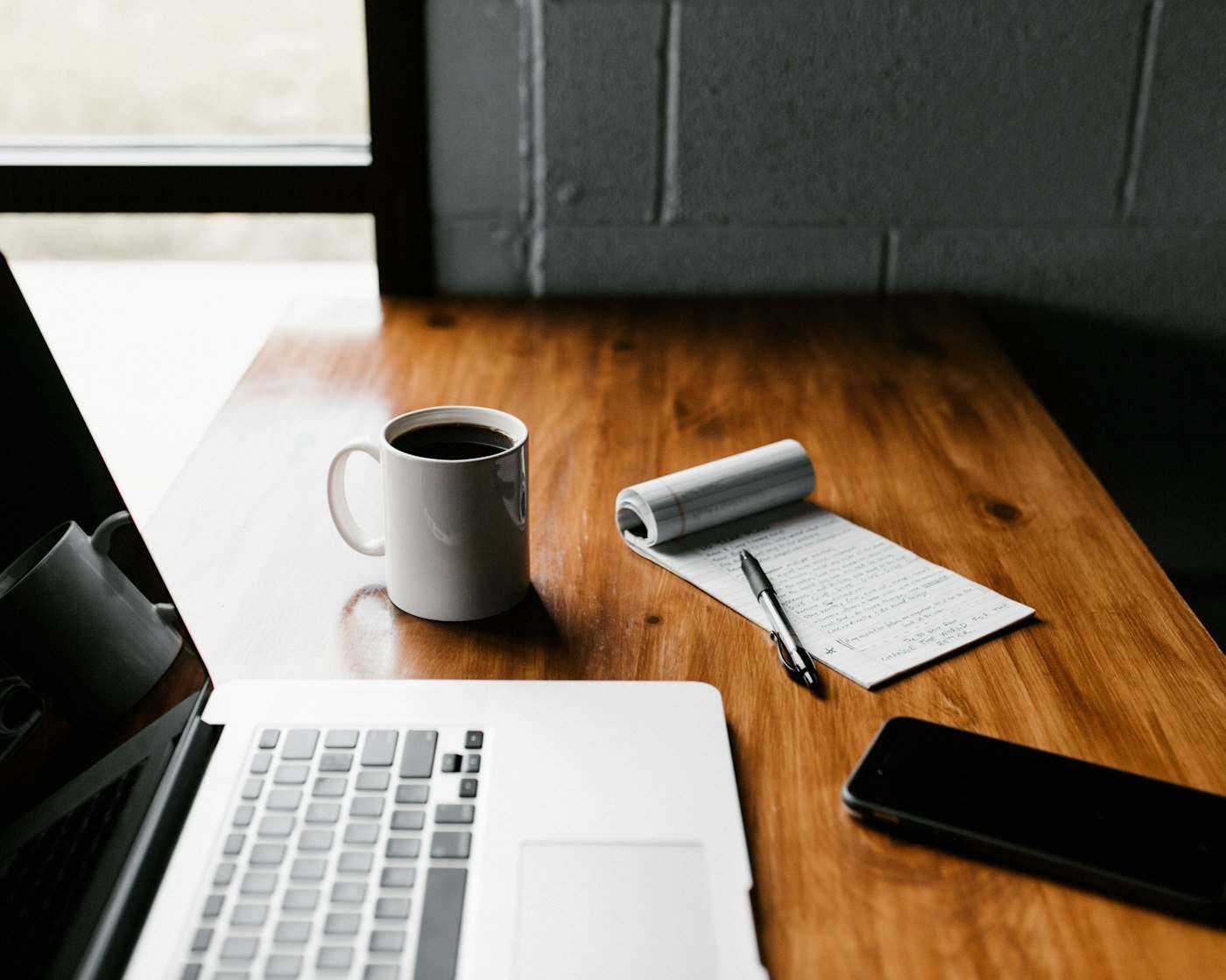 A desk with notes and analytics representing practical marketing thinking